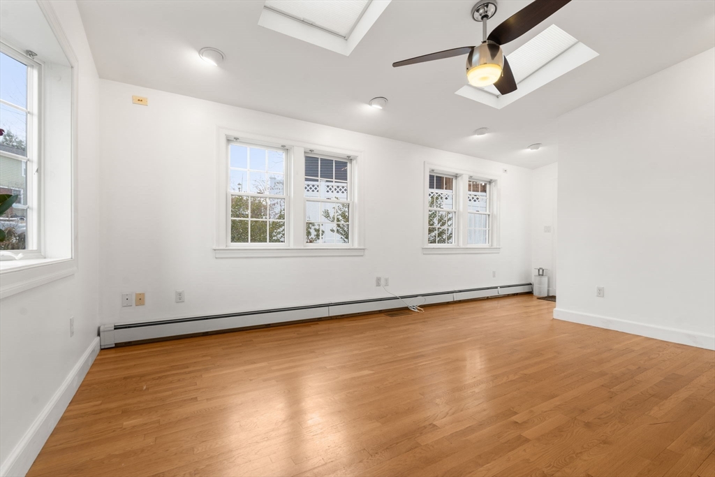 73 Roundwood Road Newton, MA 02464 - Photo 20 of 42 an empty room with window and ceiling fan
