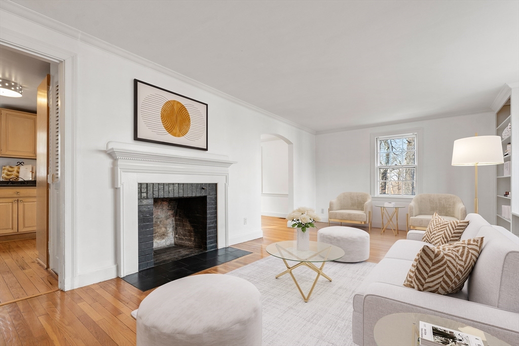 73 Roundwood Road Newton, MA 02464 - Photo 2 of 42 a living room with furniture and a fireplace