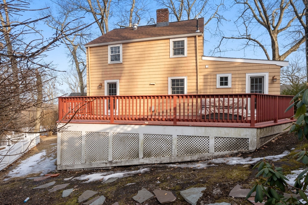 73 Roundwood Road Newton, MA 02464 - Photo 28 of 42 a view of a house with wooden fence