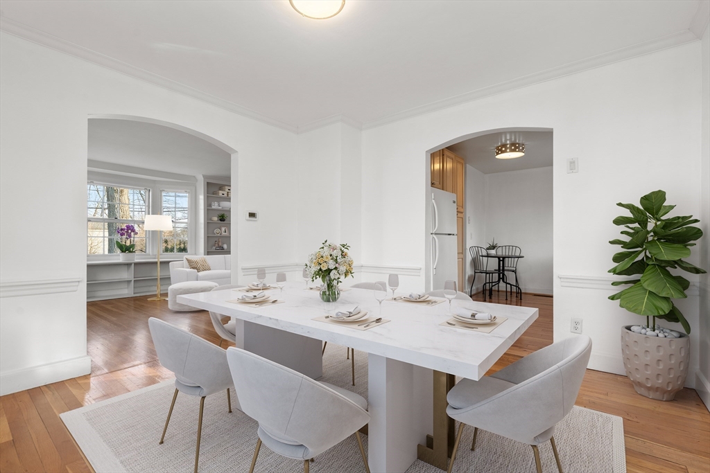 73 Roundwood Road Newton, MA 02464 - Photo 3 of 42 a dining room with a table and chairs