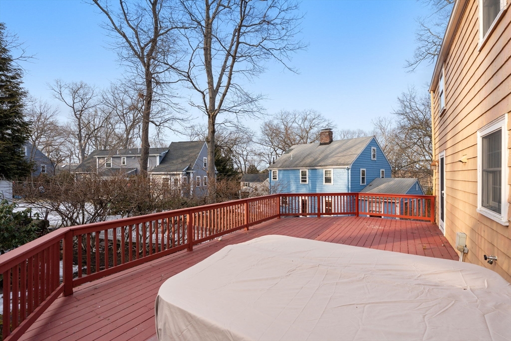 73 Roundwood Road Newton, MA 02464 - Photo 31 of 42 a view of a house with wooden deck and trees
