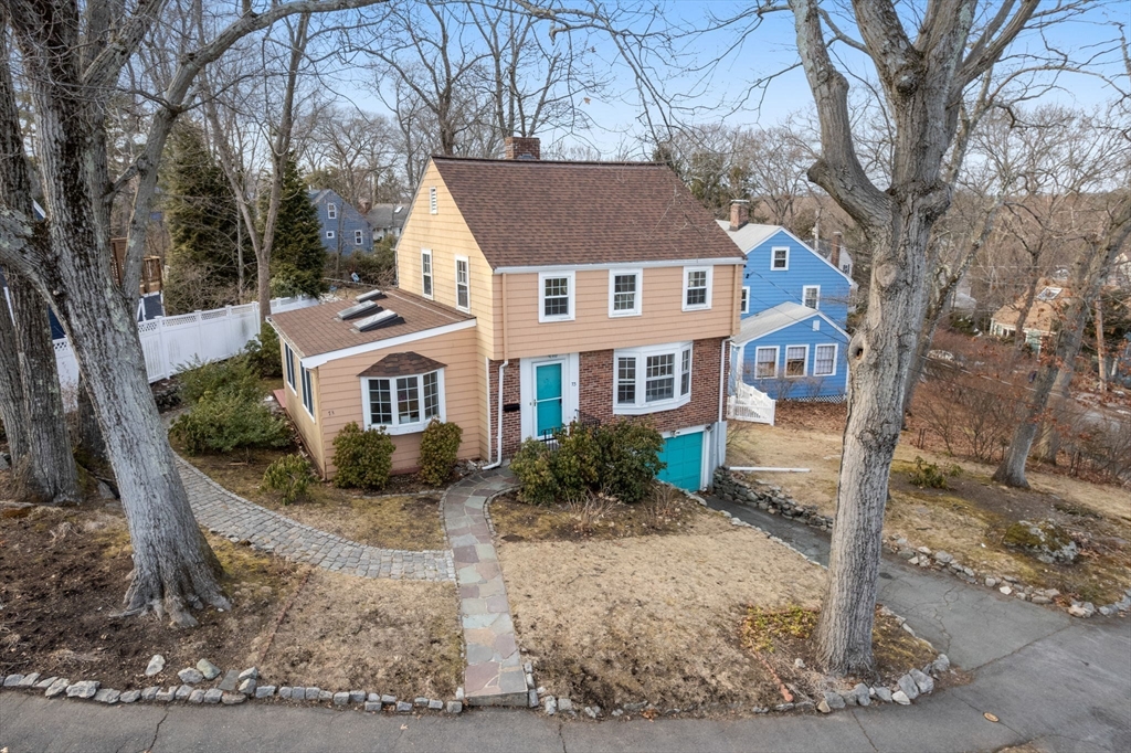 73 Roundwood Road Newton, MA 02464 - Photo 34 of 42 a front view of a house with a yard