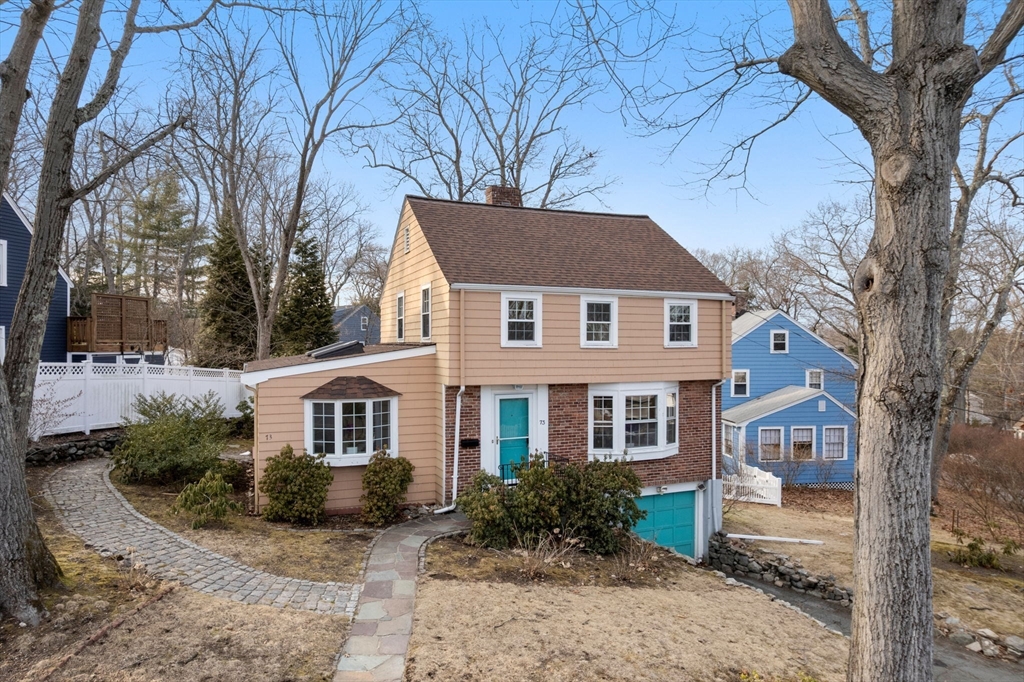 73 Roundwood Road Newton, MA 02464 - Photo 35 of 42 a front view of a house with garden