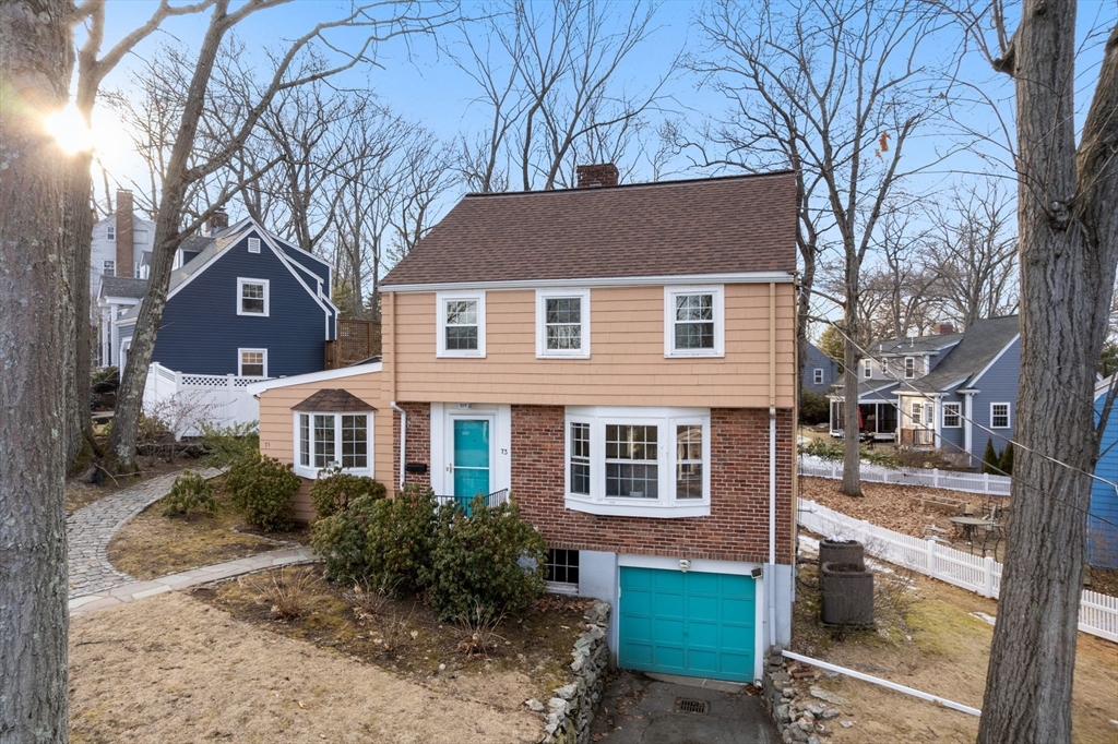73 Roundwood Road Newton, MA 02464 - Photo 36 of 42 a front view of a house with a yard