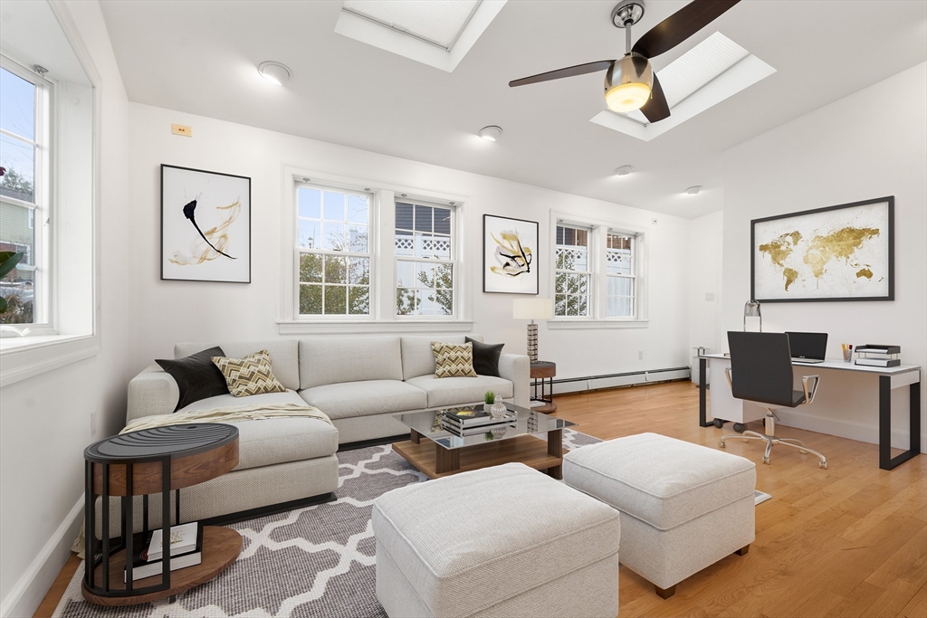 73 Roundwood Road Newton, MA 02464 - Photo 4 of 42 a living room with furniture a desk and chair with wooden floor