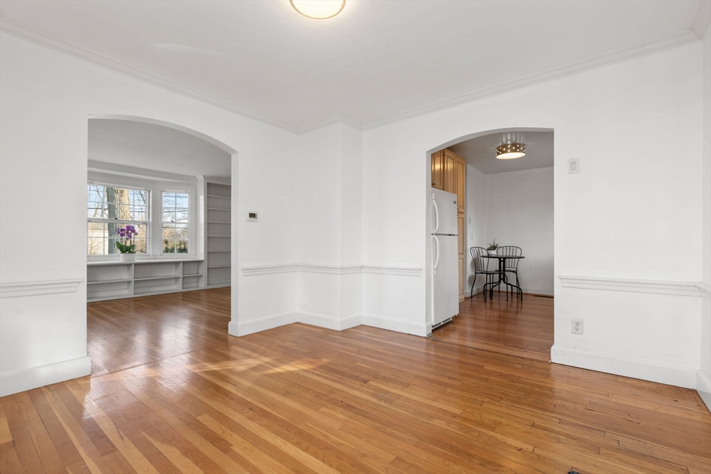 73 Roundwood Road Newton, MA 02464 - Photo 10 of 42 a view of a room with wooden floor and a hallway