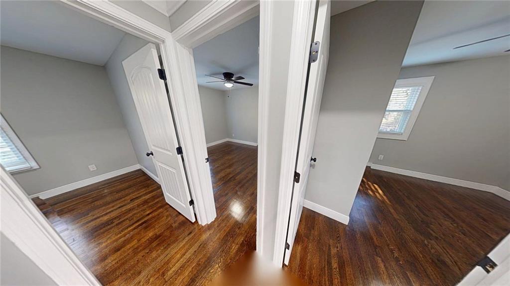 4834 Bartlett Road Forest Park, GA 30297 - Photo 11 of 20 a view of an entryway with wooden floor and a hallway