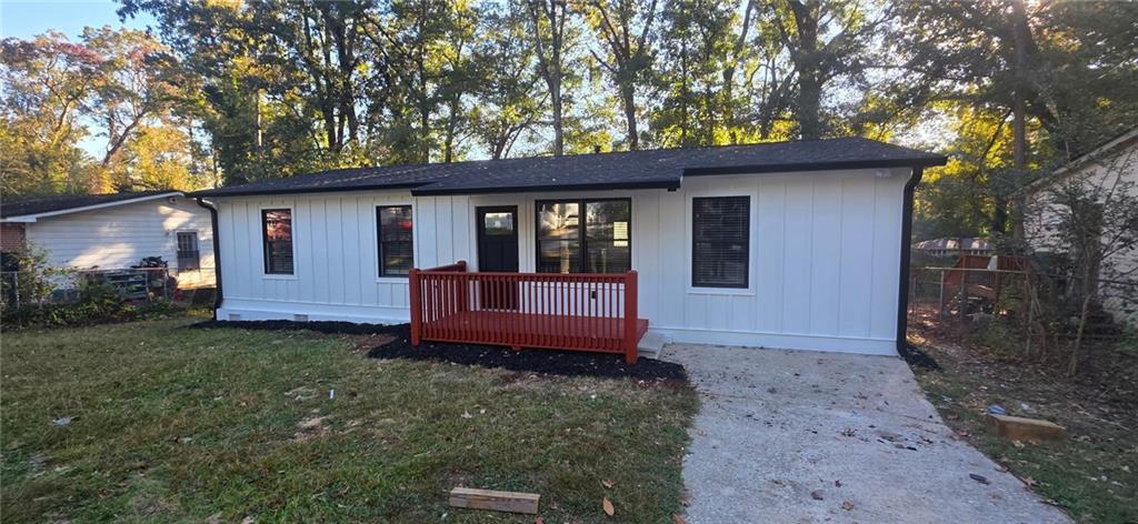4834 Bartlett Road Forest Park, GA 30297 - Photo 15 of 20 a front view of a house with a garden