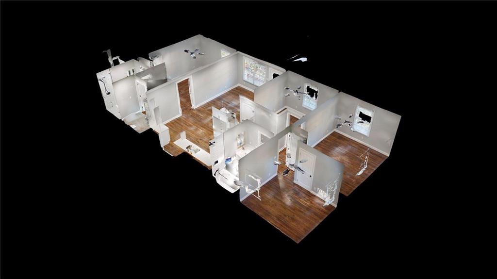 4834 Bartlett Road Forest Park, GA 30297 - Photo 2 of 20 a white bed sitting in a middle of a room