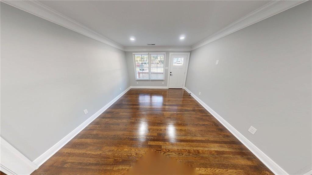 4834 Bartlett Road Forest Park, GA 30297 - Photo 5 of 20 a view of gallery with wooden floor
