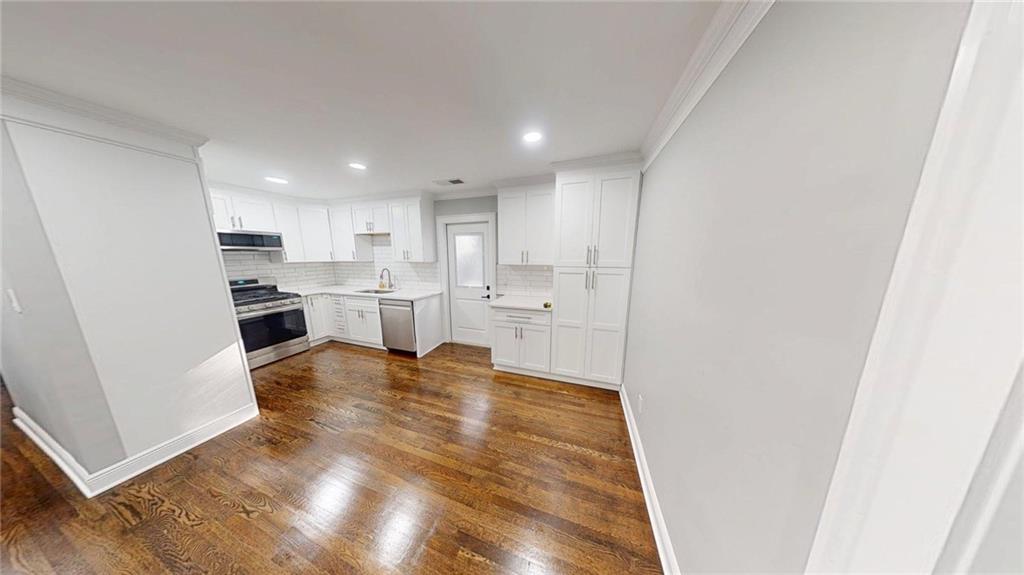 4834 Bartlett Road Forest Park, GA 30297 - Photo 6 of 20 a view of kitchen with wooden floor