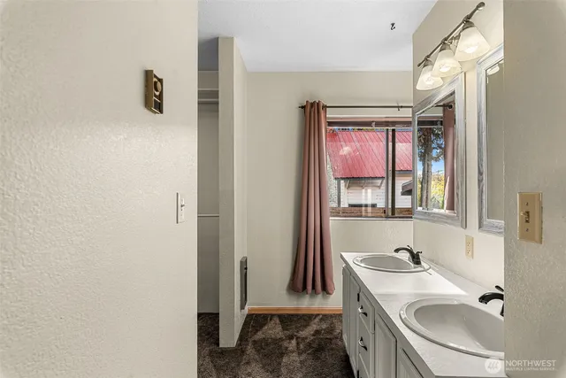 a bathroom with a sink a vanity and mirror