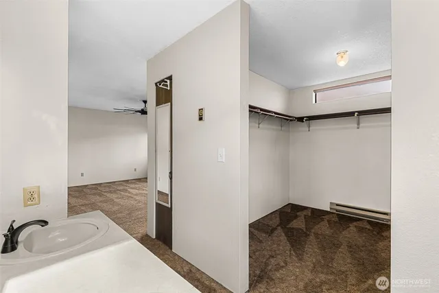 a bathroom with a sink and shower