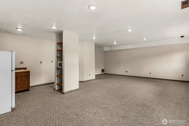 a kitchen with a sink cabinets and appliances