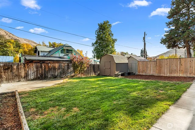 a front view of house with yard and seating area