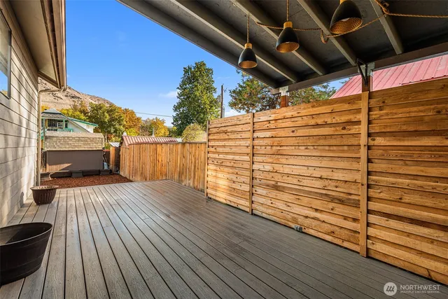 a view of a balcony with wooden floor