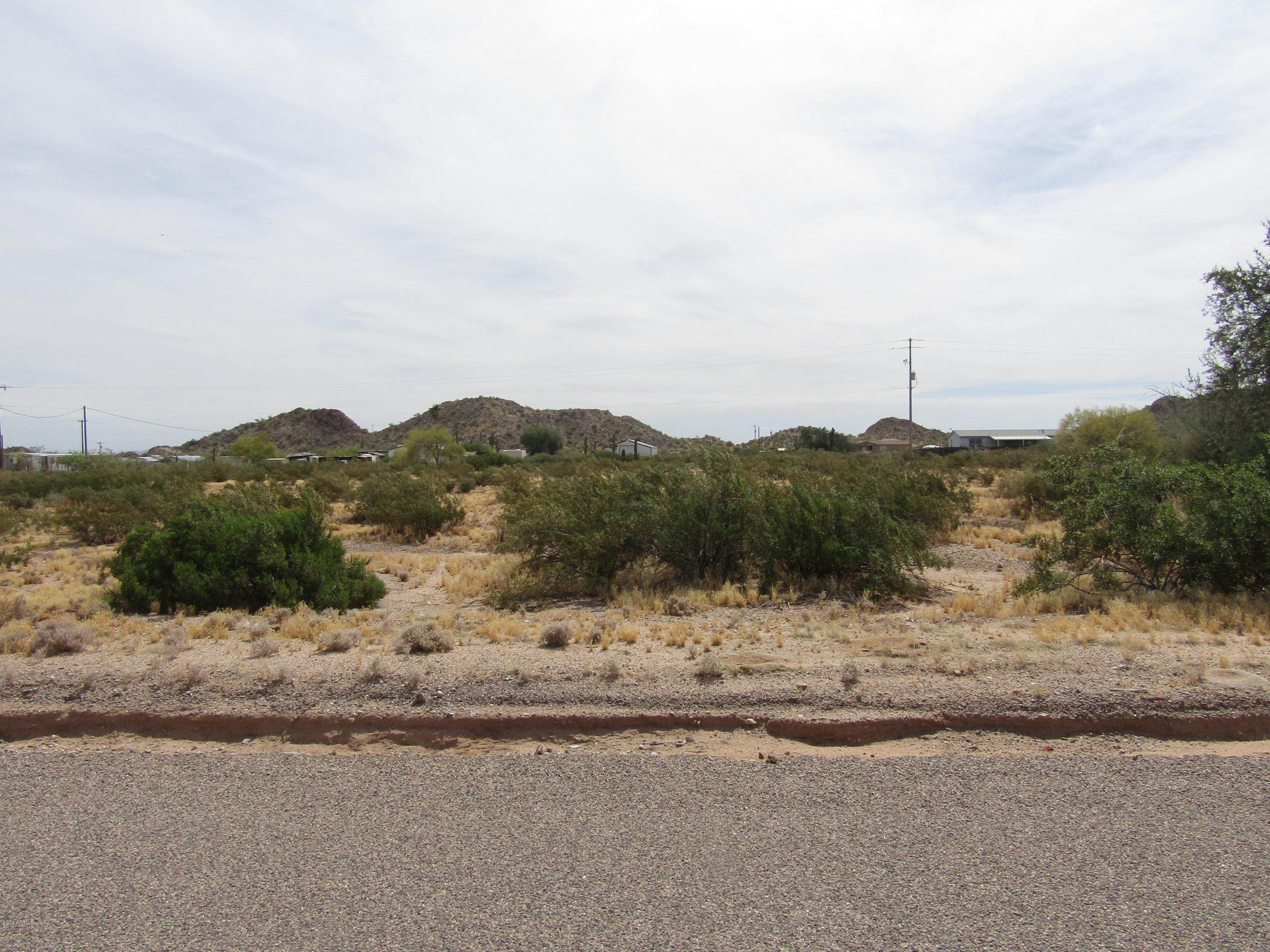 435 South Tejon Road, Unit 147 Maricopa, AZ 85139 - Photo 3 of 4 a view of a lake view and mountain