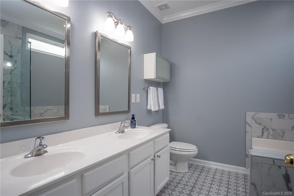 307 Prestmont Court Fort Mill, SC 29708 - Photo 22 of 38 a bathroom with a sink toilet and shower