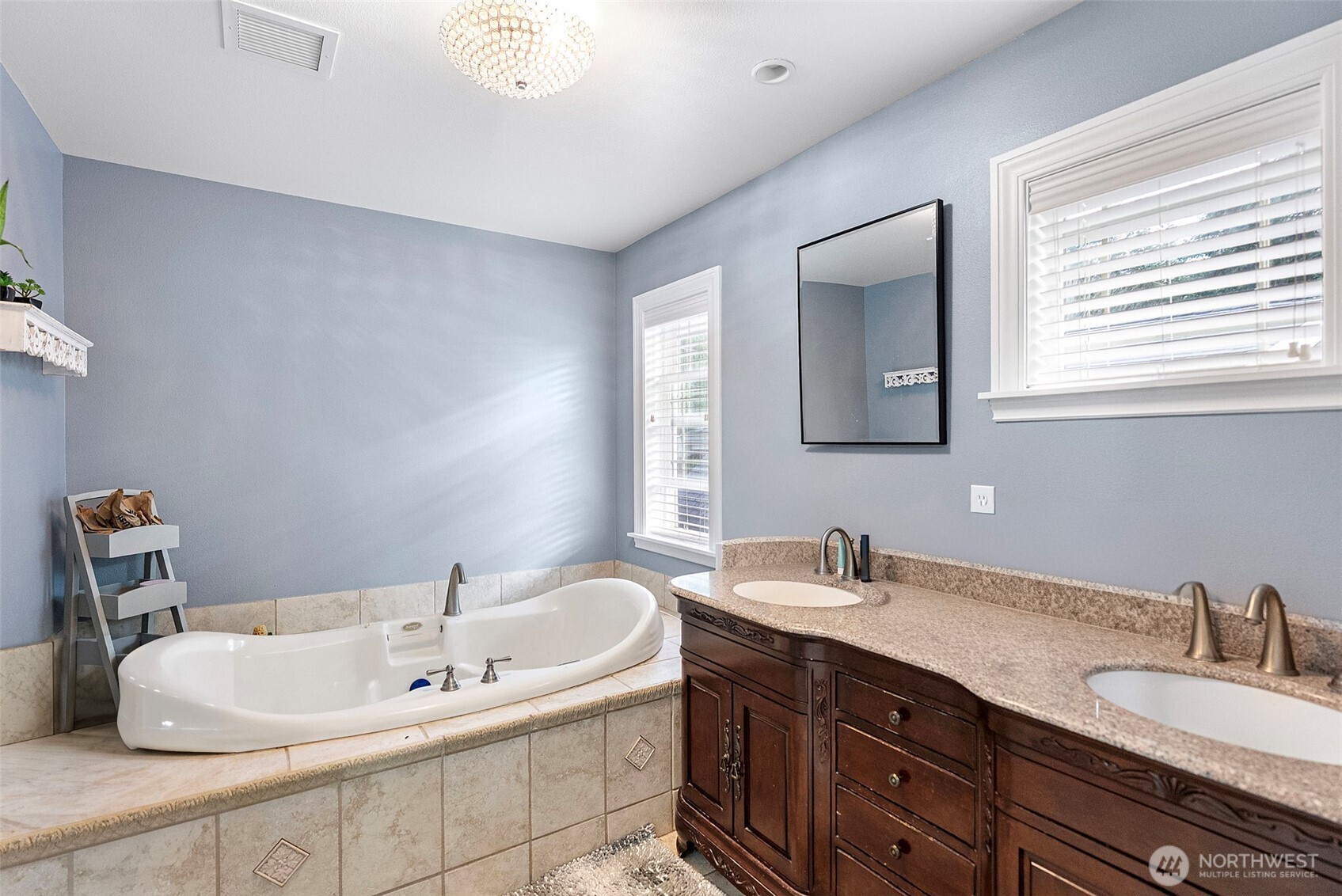 2300 Northeast Solar View Court Poulsbo, WA 98370 - Photo 15 of 28 a bathroom with a double vanity sink and a mirror