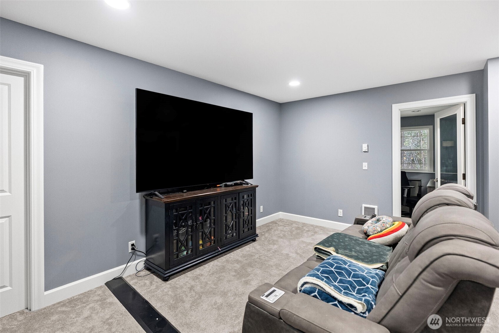 2300 Northeast Solar View Court Poulsbo, WA 98370 - Photo 18 of 28 a living room with furniture and a flat screen tv