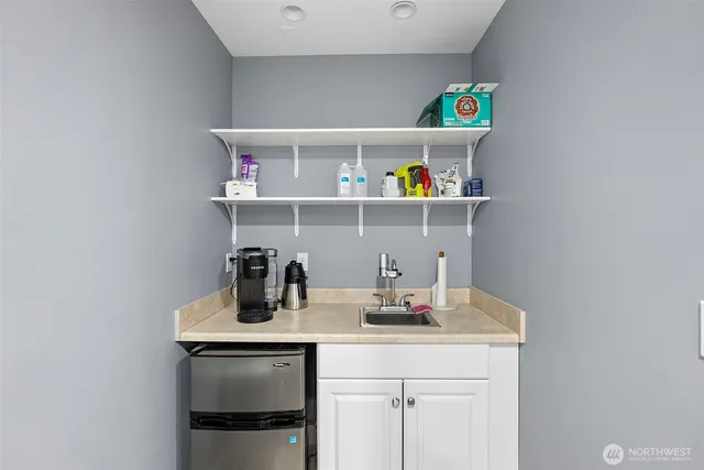 a stove top oven sitting inside of a kitchen