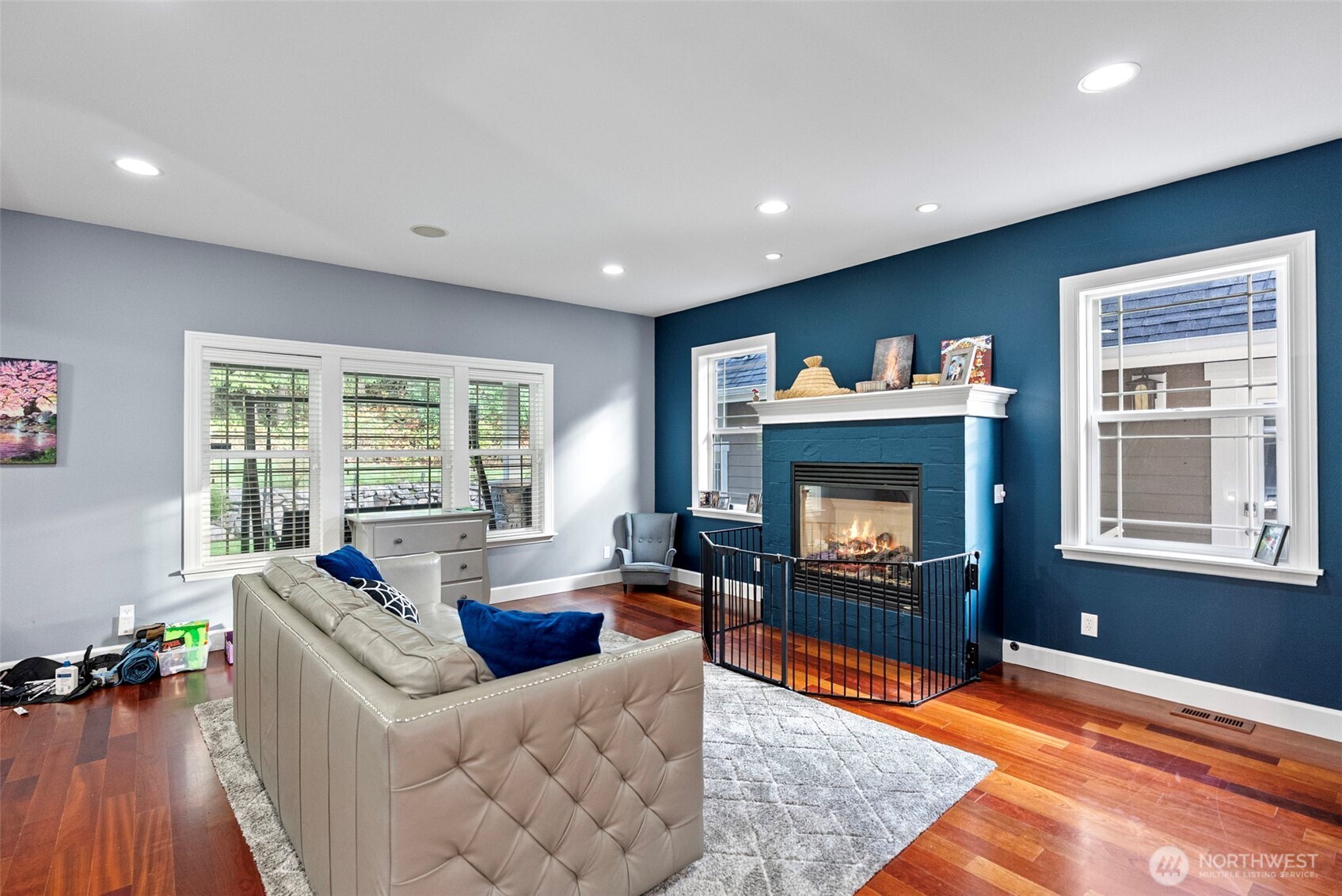 2300 Northeast Solar View Court Poulsbo, WA 98370 - Photo 8 of 28 a living room with furniture a fireplace and a flat screen tv