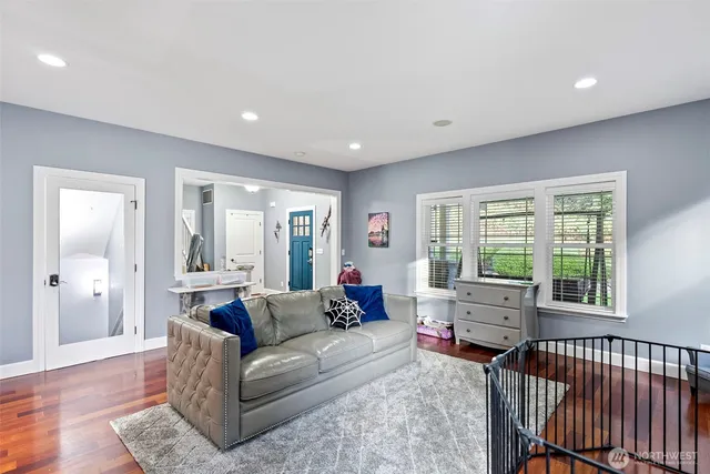 a living room with furniture and windows