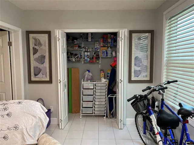 a bedroom with a bed and a closet