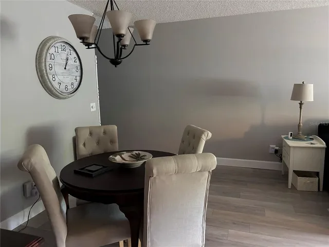 a view of a dining area with furniture and a mirror