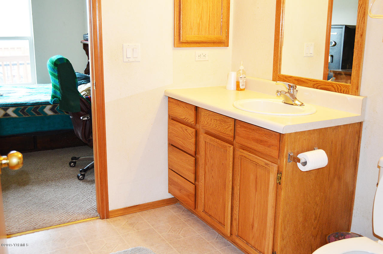 16695 Summitview Road Cowiche, WA 98923 - Photo 8 of 20 a bathroom with a sink and mirror
