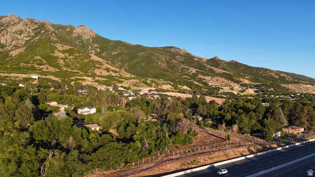 1792 Valley View Drive Layton, UT 84040 - Photo 10 of 18 Residential properties nestled amongst abundant mature trees, positioned at the base of a verdant mountain range