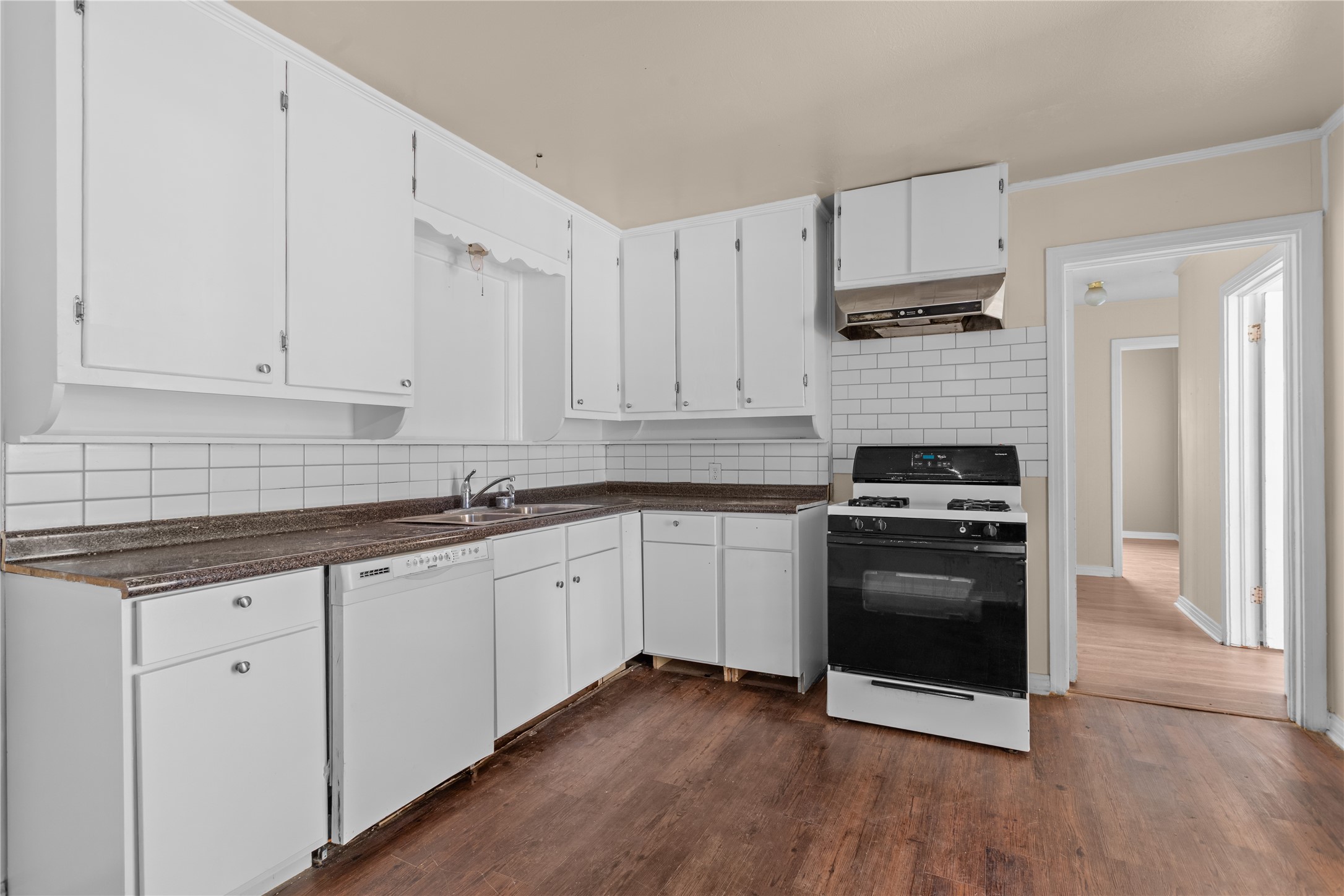 801 Evetts Road Killeen, TX 76541 - Photo 7 of 16 White cabinetry and subway tile backsplash elevate this highly functional kitchen space.