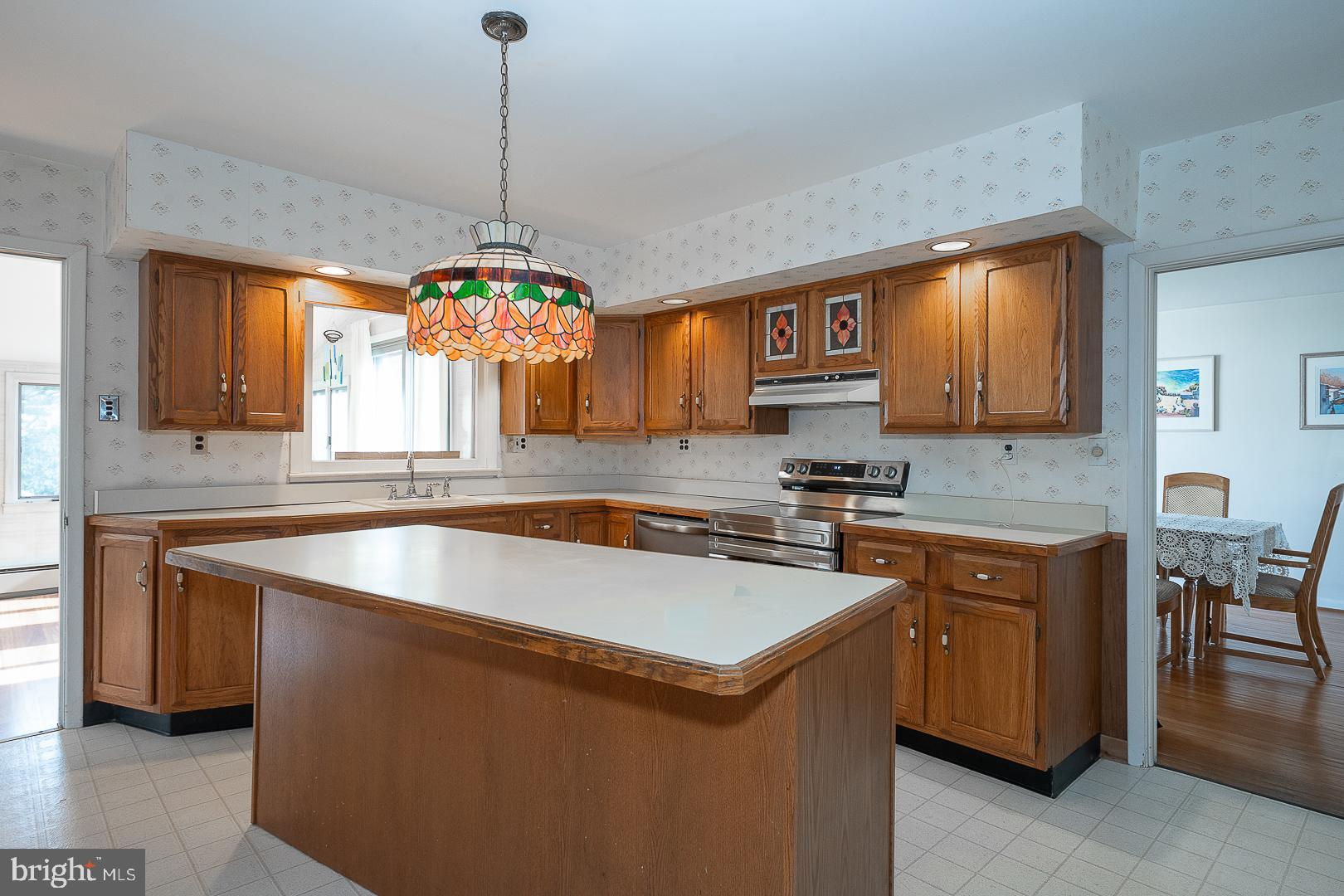 11 Tenby Road Havertown, PA 19083 - Photo 12 of 62 a kitchen that has a lot of cabinets in it