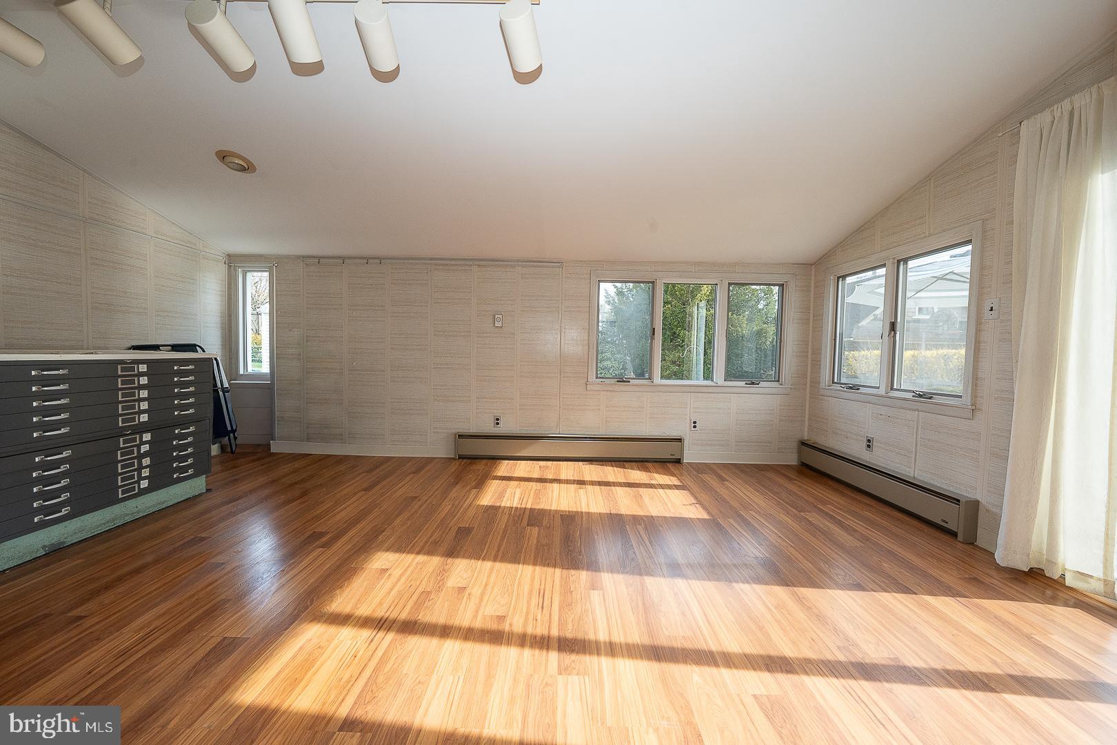 11 Tenby Road Havertown, PA 19083 - Photo 16 of 62 an empty room with wooden floor and windows