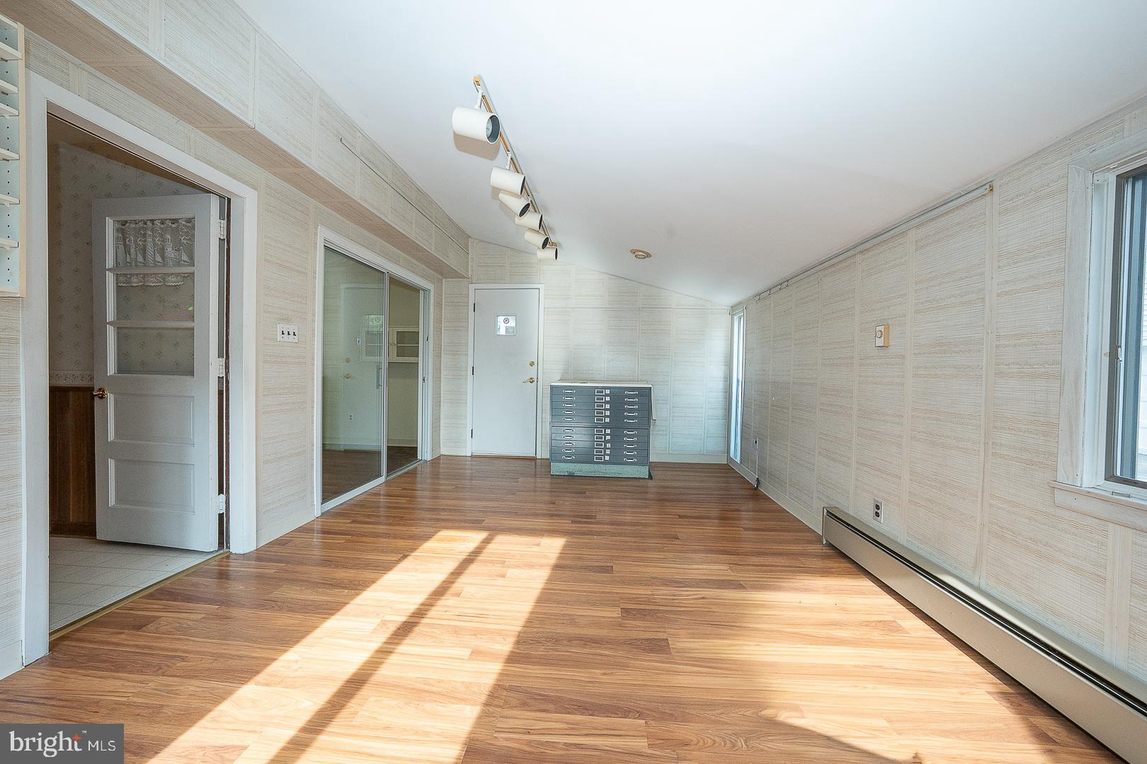 11 Tenby Road Havertown, PA 19083 - Photo 17 of 62 a view of empty room with wooden floor and fan
