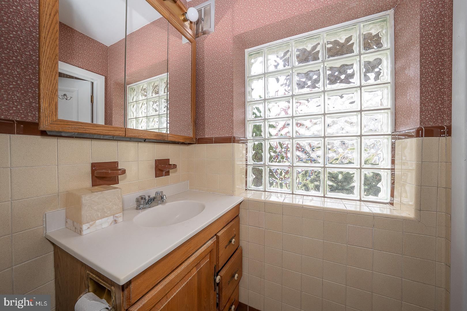 11 Tenby Road Havertown, PA 19083 - Photo 21 of 62 a bathroom with a sink and a window