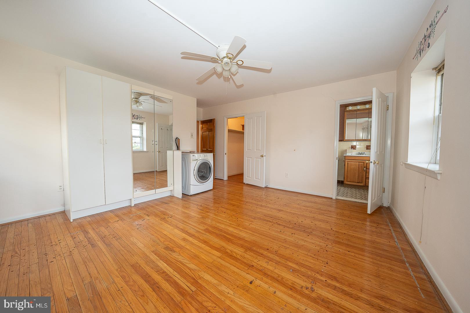 11 Tenby Road Havertown, PA 19083 - Photo 22 of 62 a view of empty room with wooden floor and ceiling fan