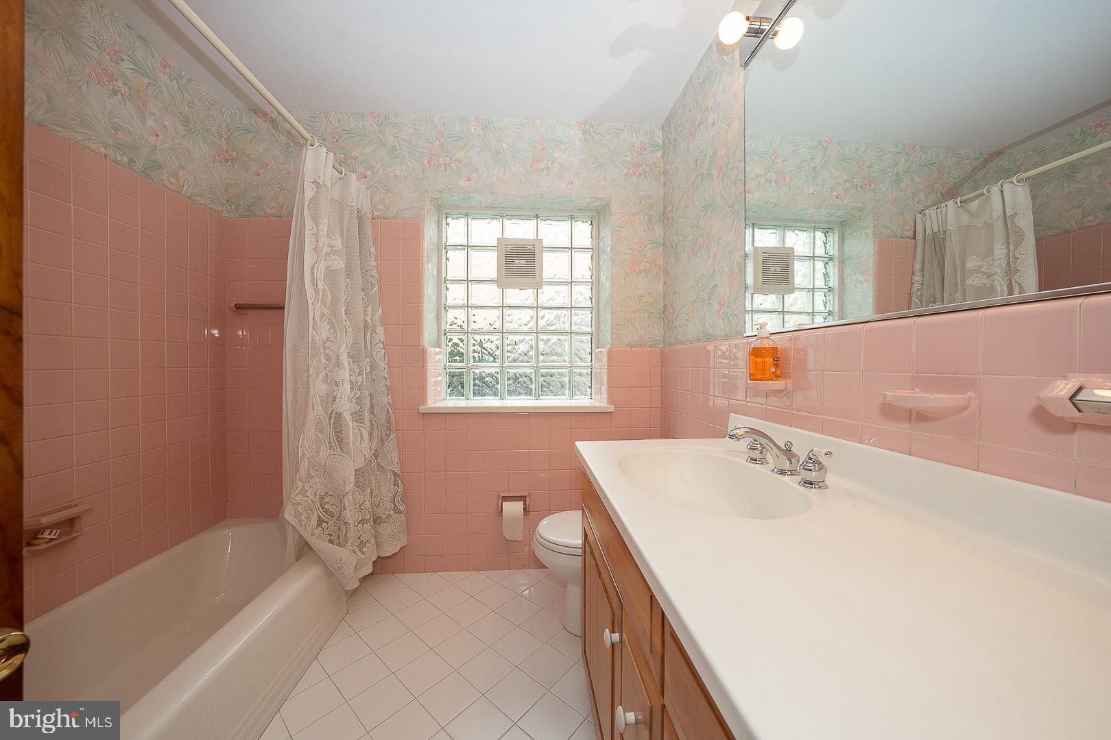 11 Tenby Road Havertown, PA 19083 - Photo 25 of 62 a bath room with a sink and a bath tub