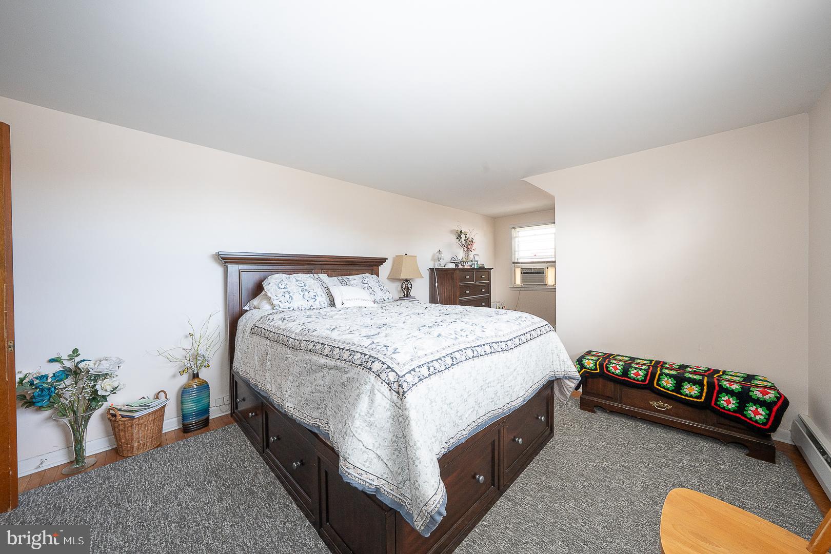 11 Tenby Road Havertown, PA 19083 - Photo 44 of 62 a spacious bedroom with a bed and a potted plant