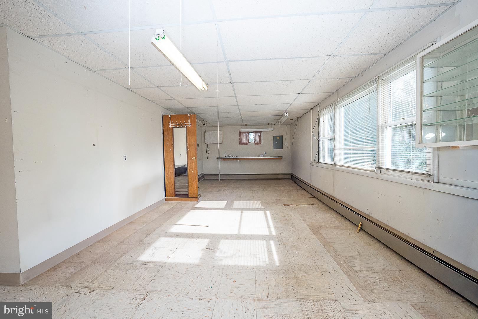 11 Tenby Road Havertown, PA 19083 - Photo 54 of 62 a view of empty room with wooden floor and fan