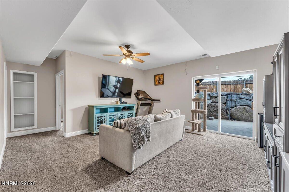 15770 Rocky Vista Road Reno, NV 89521 - Photo 26 of 68 a living room with furniture and a flat screen tv