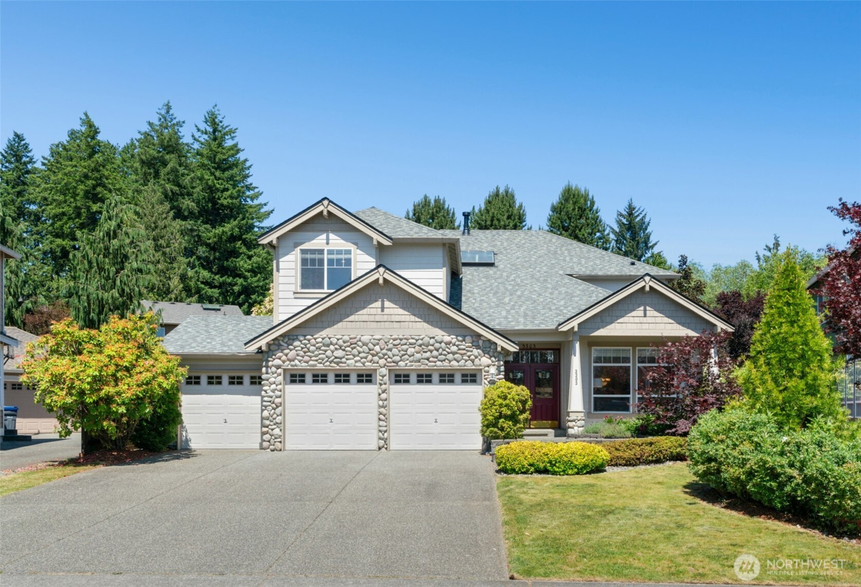 3303 174th Place Southeast Bothell, WA 98012 - Photo 1 of 32 a view of a house with a yard and potted plants