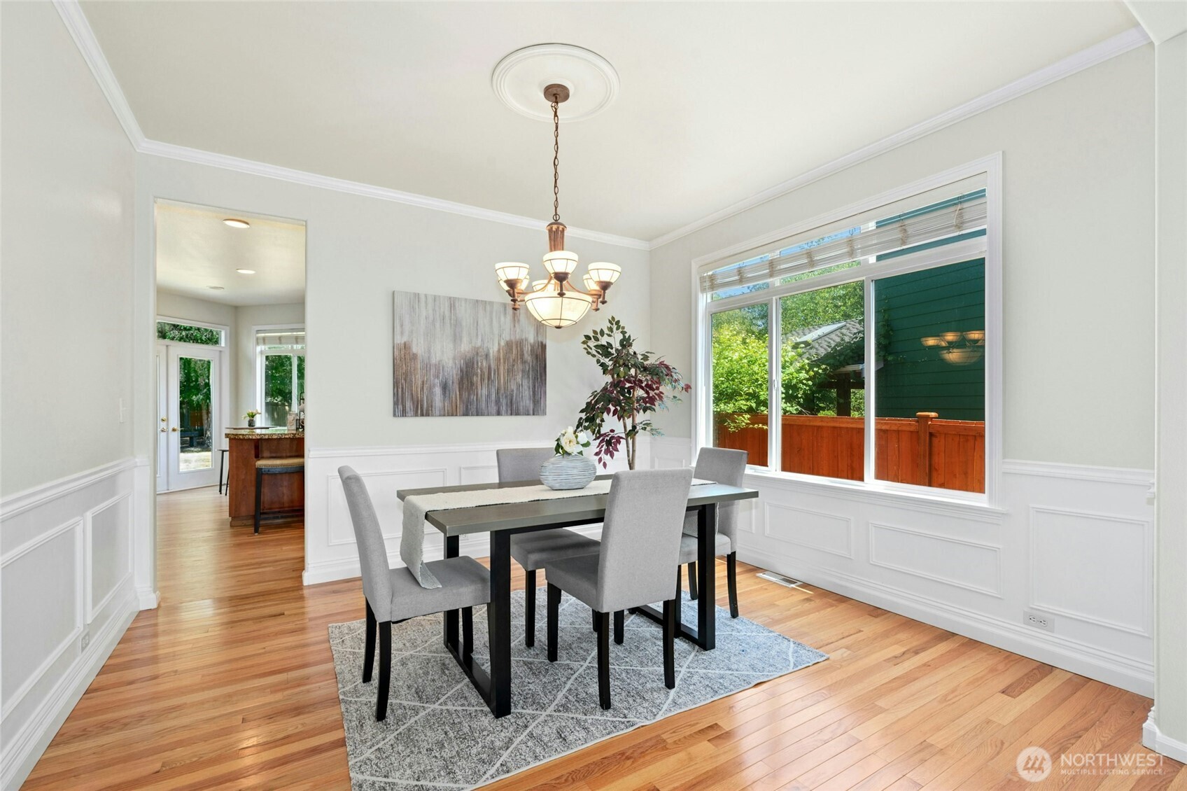 3303 174th Place Southeast Bothell, WA 98012 - Photo 12 of 32 a view of a dining room with furniture window and wooden floor