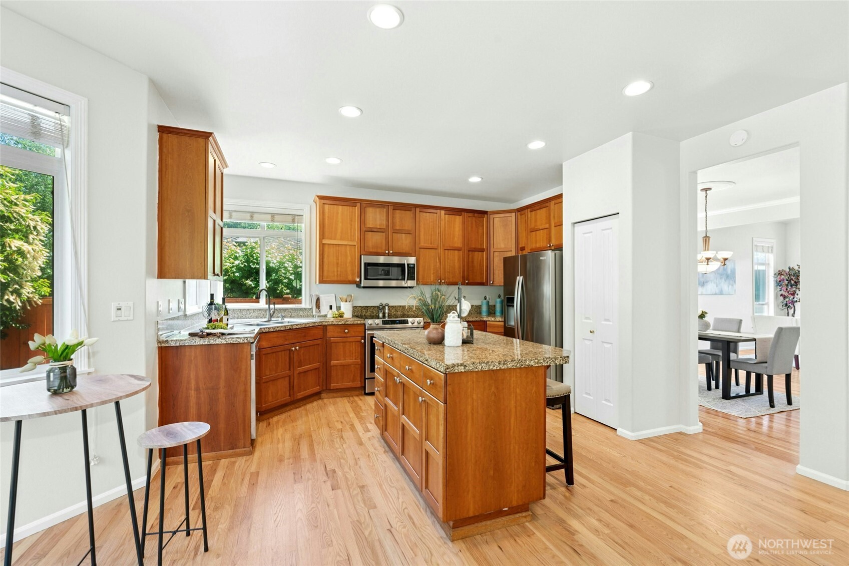 3303 174th Place Southeast Bothell, WA 98012 - Photo 14 of 32 a large kitchen with a table and chairs in it