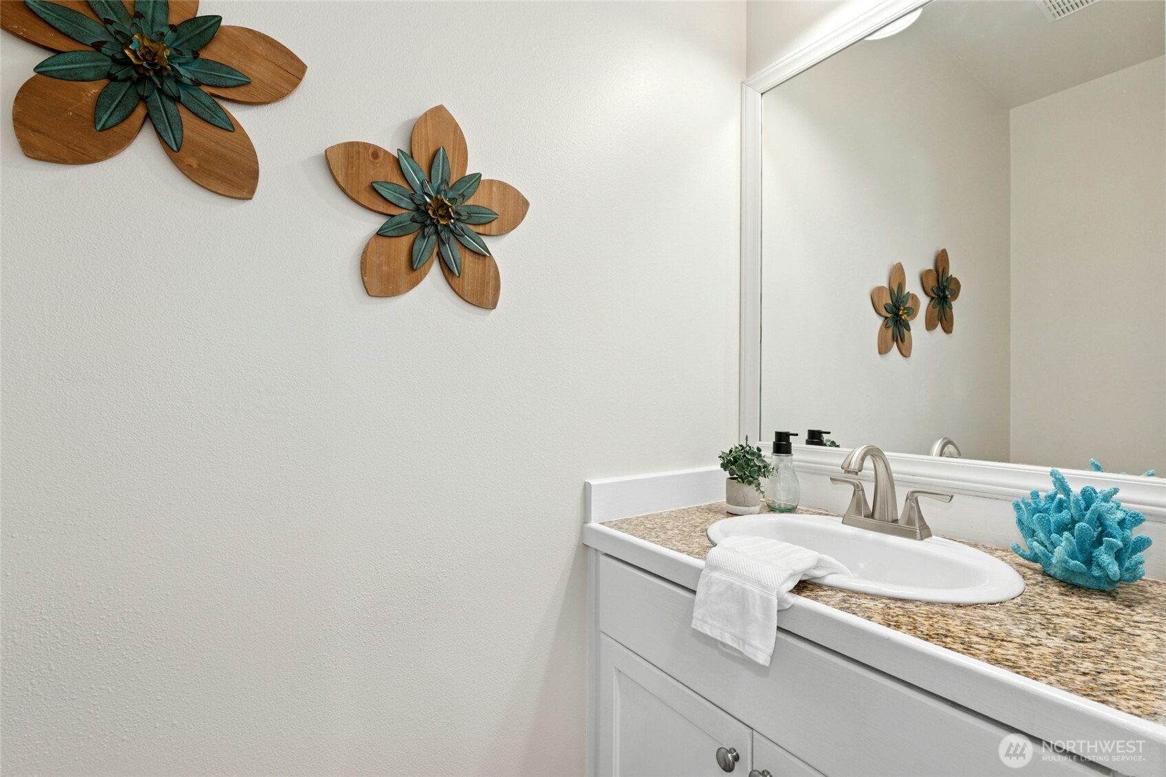 3303 174th Place Southeast Bothell, WA 98012 - Photo 17 of 32 a bathroom with a sink a mirror and a shower