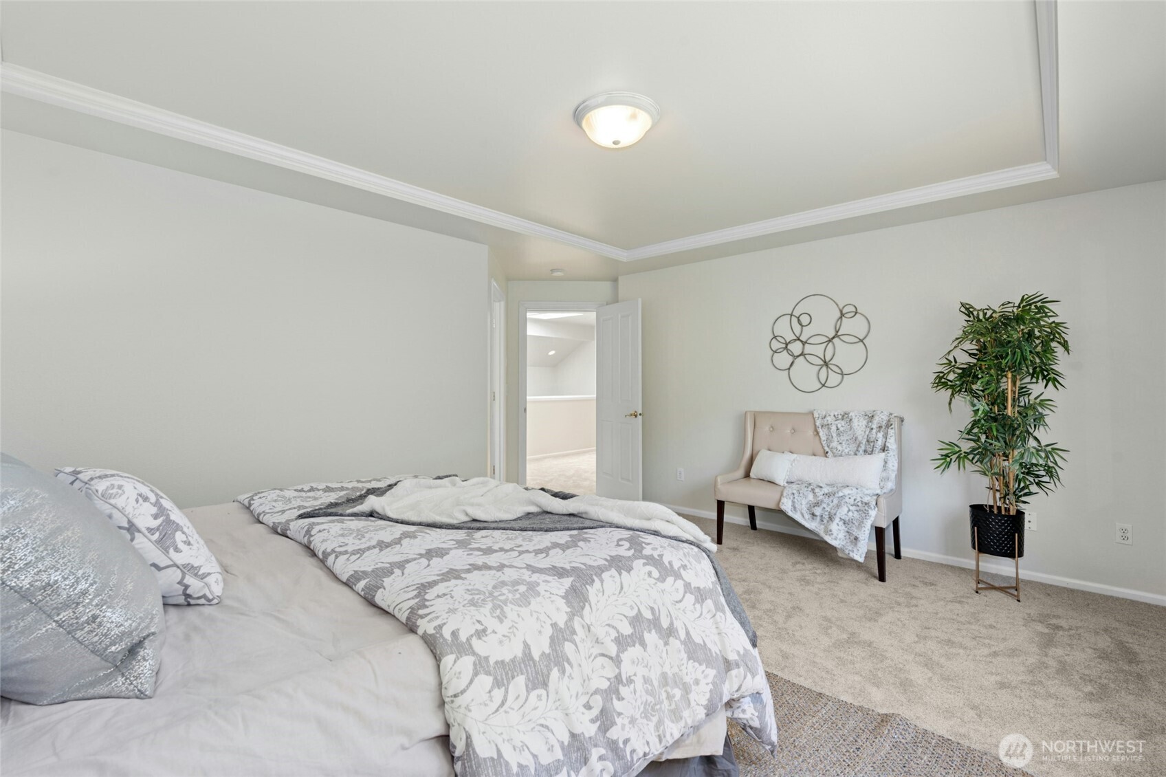 3303 174th Place Southeast Bothell, WA 98012 - Photo 19 of 32 a bedroom with a large bed and a couch