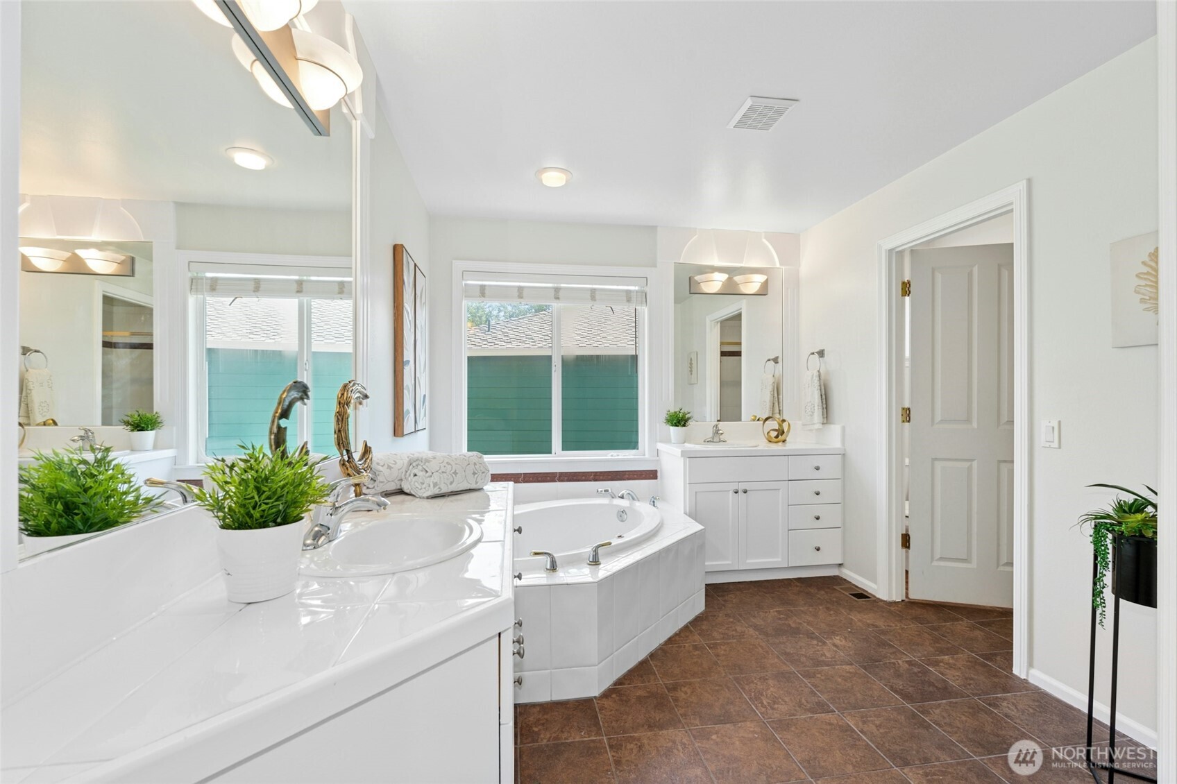 3303 174th Place Southeast Bothell, WA 98012 - Photo 20 of 32 a bathroom with a tub sink and mirror