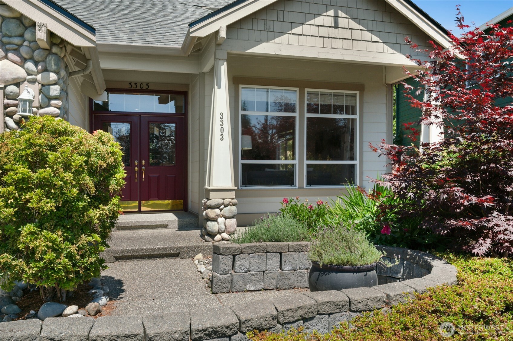 3303 174th Place Southeast Bothell, WA 98012 - Photo 2 of 32 a view of a house with potted plants