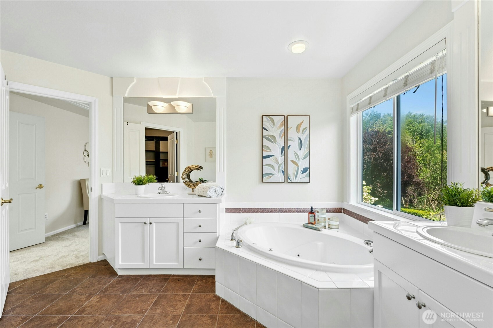3303 174th Place Southeast Bothell, WA 98012 - Photo 21 of 32 a spacious bathroom with a bathtub sink and mirror