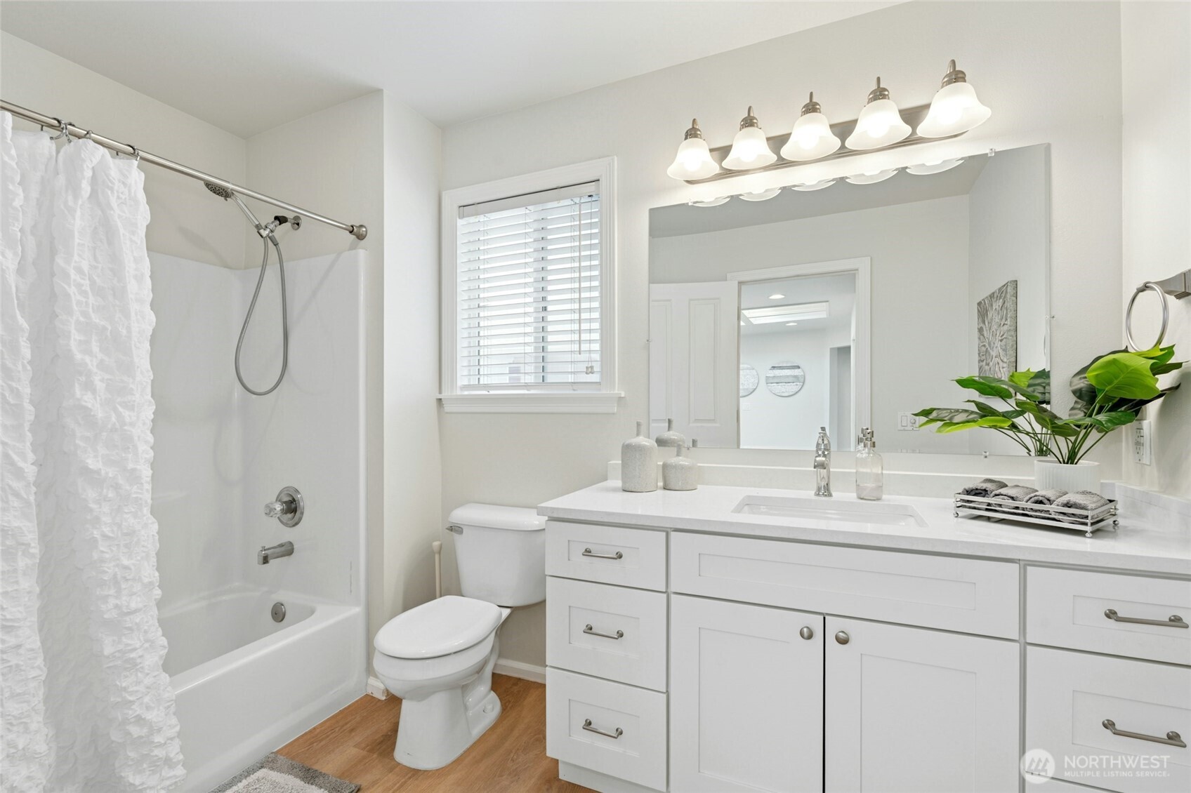 3303 174th Place Southeast Bothell, WA 98012 - Photo 25 of 32 a bathroom with a double vanity sink toilet mirror and shower